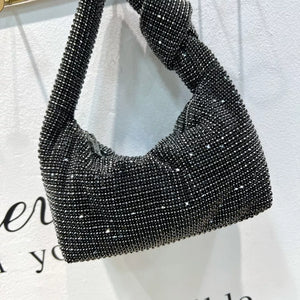 Black rhinestone crescent tote bag with knotted strap