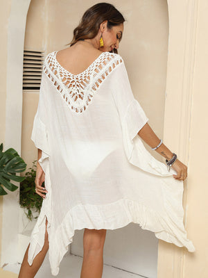 Ivory crochet yoke ruffle hem cover-up with V-neck and bell sleeves.