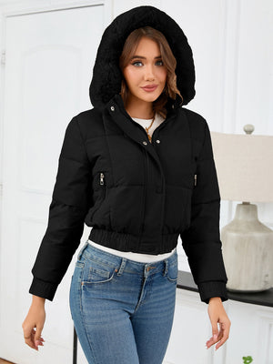 Black puffer jacket with faux fur trim hood, zip pockets and elastic hem