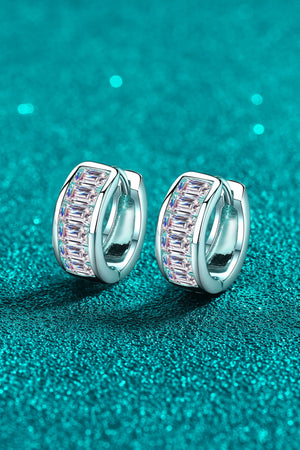 Silver baguette cut crystal huggie hoop earrings with a row of sparkling crystals.
