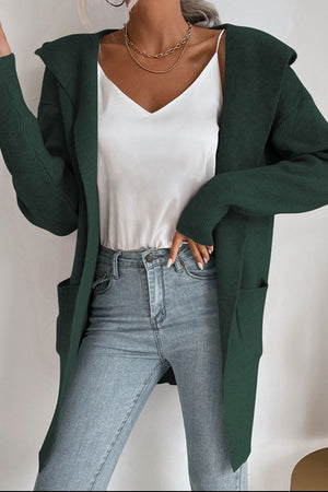 Black Forest hooded ribbed knit cardigan with pockets, worn open over a white cami and jeans.