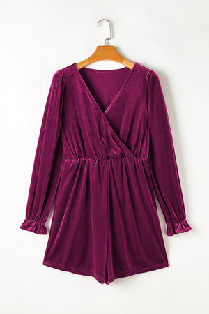 Burgundy velvet wrap romper with long sleeves and ruffled cuffs