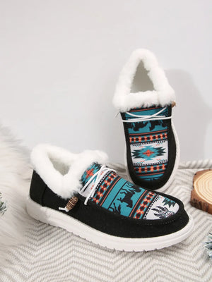 Southwestern print faux fur lined loafers with white laces and wooden toggle detail.