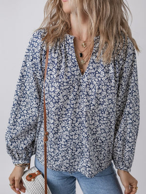 Navy floral print blouse with notched neckline and long sleeves