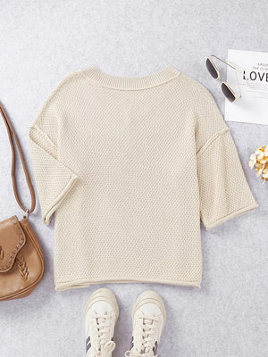 Beige V-neck knit sweater with subtle heart pattern, cotton blend, casual style.