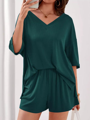 Green ribbed V-neck lounge set with relaxed fit top and shorts.
