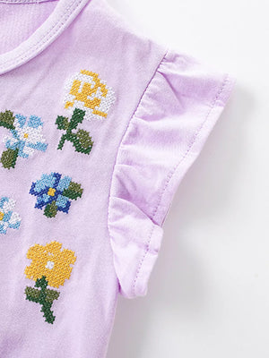 Lavender toddler dress with embroidered floral cross-stitch detail and ruffled sleeves.