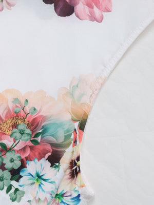 Painterly floral sleeveless blouse in Gum Leaf with a bow-neck detail.