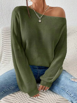 Dark green asymmetrical knit sweater with off-shoulder neckline and ribbed texture.