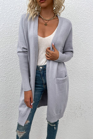 Light grey ribbed cuff open-front cardigan with pockets, styled with a white tank and distressed jeans.