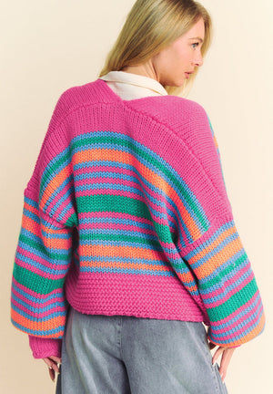 Chunky stripe balloon sleeve cardigan in pink with blue, green, and orange stripes.