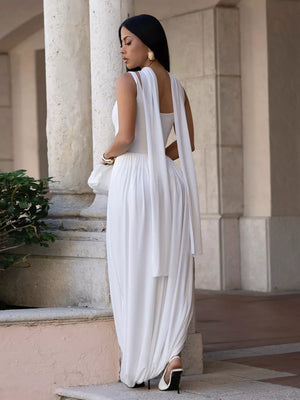 White scoop neck maxi dress with draped fabric and a thigh-high slit.