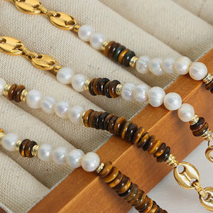 Gold pearl and tiger eye statement necklace with unique chain links