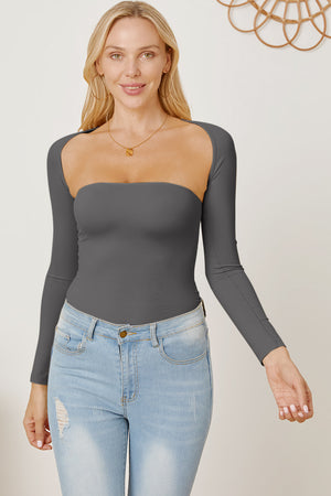 Dark gray long sleeve bodysuit with square neckline and open back detail, styled with jeans.