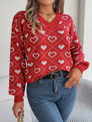 Deep Red acrylic V-neck sweater with a white heart jacquard pattern and long sleeves.