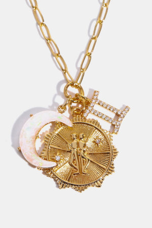 Gold Gemini zodiac pendant necklace with opal moon and diamond accents