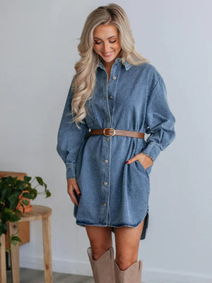 Medium wash denim shirtdress with button front, side slits, and belt