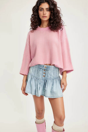 Light blue denim ruffle mini skirt with lace-up front and button details