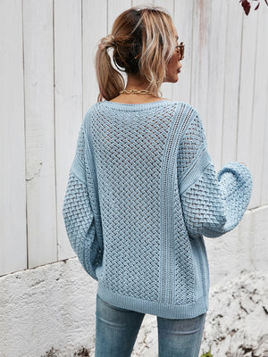 Open-knit sweater in Misty Blue with balloon sleeves and a relaxed fit.