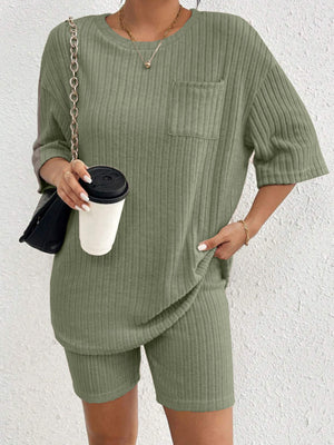 Sage ribbed lounge set with crew neck top and shorts, featuring a chest pocket.