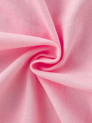 Pink cotton t-shirt fabric detail with soft texture.