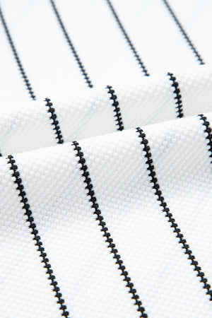 White blouse with black chevron stripes and textured fabric detail