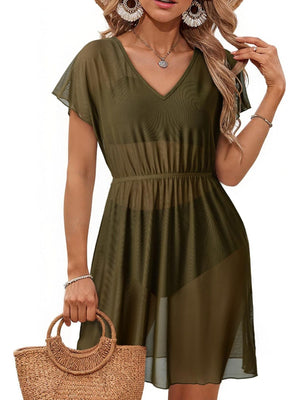 Green sheer mini dress with V-neck, short sleeves, and elastic waist.