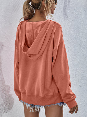 Boxy hooded sweatshirt in Tangerine with a split hem and soft fleece lining.