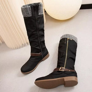 Black slouch knee-high boots with knit cuff detail and buckle strap.