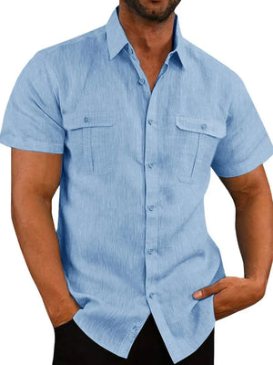 Men's light blue textured linen utility shirt with short sleeves and two chest pockets.