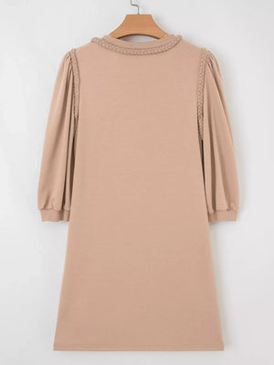 Braided puff sleeve khaki dress with braided neckline detail.