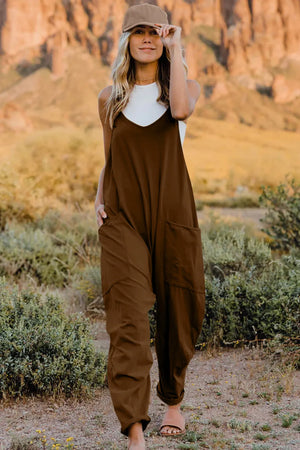 Coffee brown cotton jumpsuit with V-neck, wide legs, and pockets.