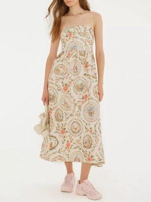 Vintage floral midi dress with spaghetti straps and a-line cut in apricot.