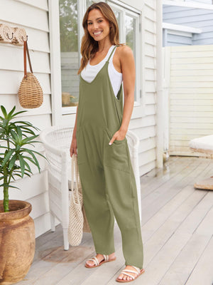 Relaxed pocketed overalls jumpsuit in sage green with V-neck and wide legs.