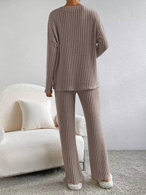 Brown ribbed knit loungewear set with crew neck top and wide leg pants.