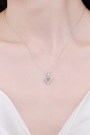 Silver geometric halo moissanite necklace with triangle pendant on a delicate chain.