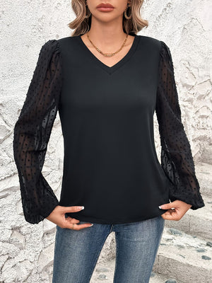 Black V-neck blouse with sheer dot puff sleeves