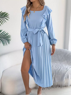 Blue A-line midi dress with ruffles, long sleeves, belted waist, and pleated skirt.