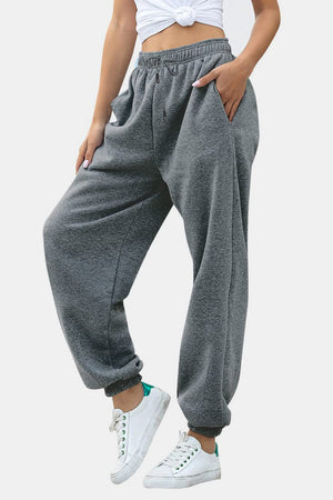 Relaxed-fit gray sweatpants with cuffed ankles and drawstring waist.
