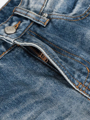 Men's blue wide leg jeans with vintage wash and button fly detail.