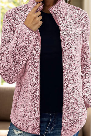 Dusty Pink teddy fleece zip-up jacket with stand collar and pockets.