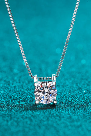 Sterling silver solitaire moissanite pendant necklace with a box chain.