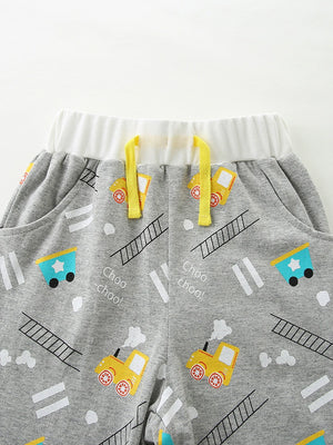 Toddler grey cotton shorts with yellow train print, white waistband, and yellow drawstring.
