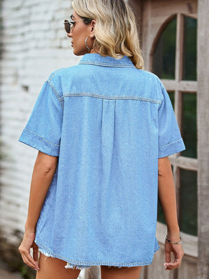 Light blue denim boxy shirt with short sleeves and a relaxed fit.