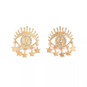 Gold evil eye dangle earrings with stars and crystal accents