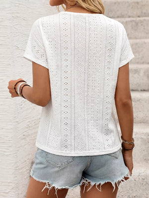 White embroidered eyelet V-neck t-shirt with short sleeves.