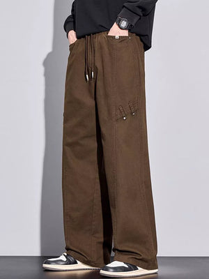 Brown loose-fit men's sweatpants with drawstring and pockets.