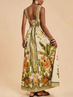 Maxi dress with tropical parrot and floral print, smocked bodice, and striped straps.