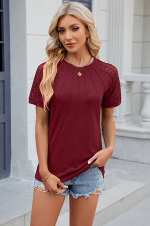 Burgundy ribbed tee with lace raglan sleeves and pintuck detail on the front.