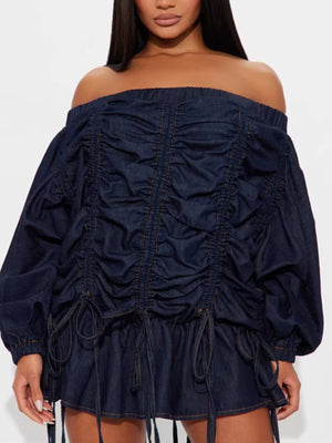 Dark navy denim dress with off-the-shoulder neckline, balloon sleeves, and adjustable ruching detail.